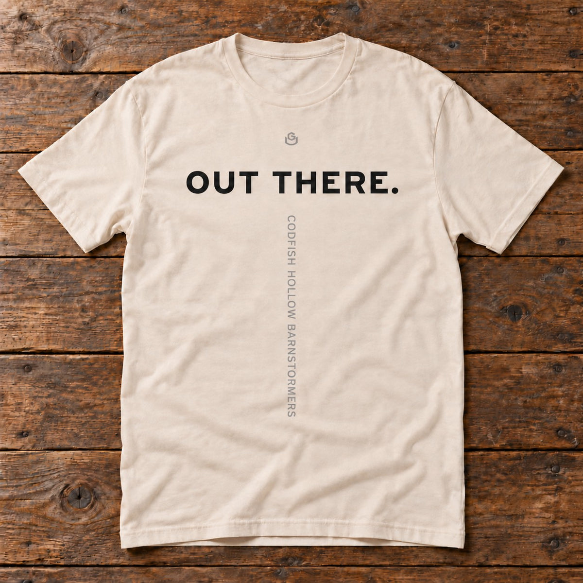 Front of the Out There Tee reading OUT THERE.