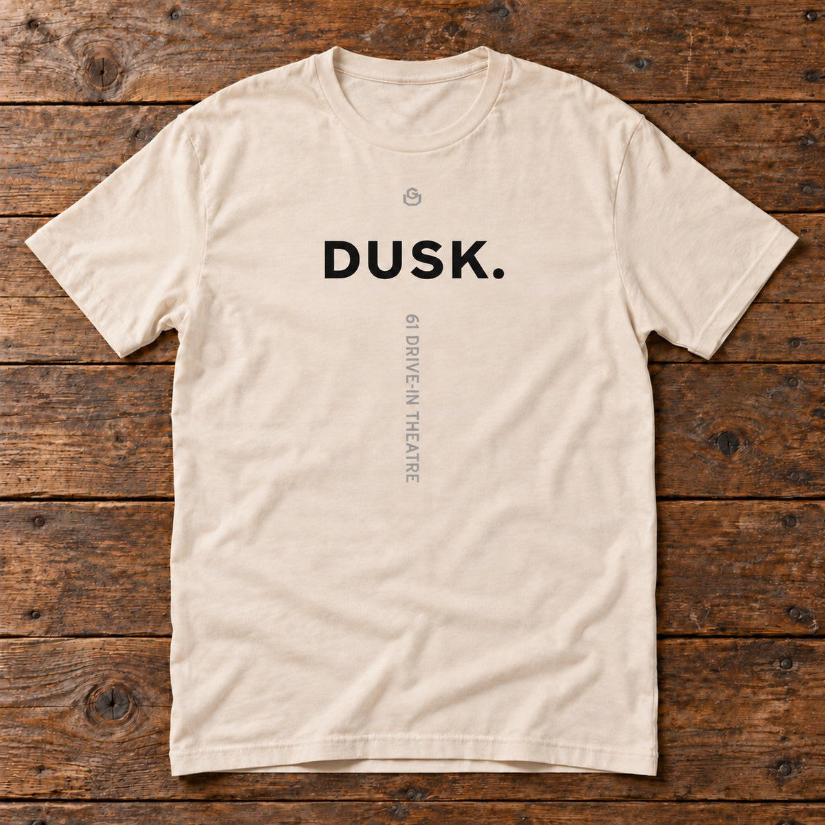 Front of the Dusk Tee reading DUSK.