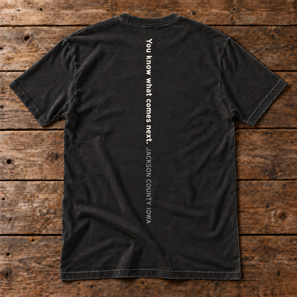 Back of the Cue the Bubbles Tee in black reading You know what comes next. Jackson County Iowa
