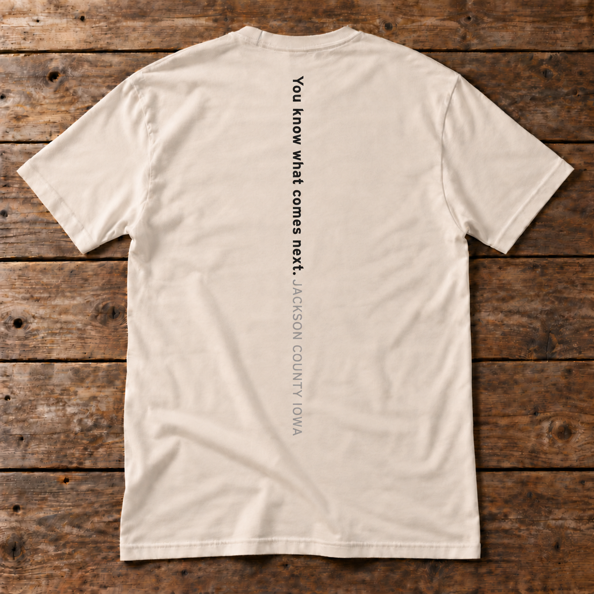 Back of the Cue the Bubbles Tee in white reading You know what comes next. Jackson County Iowa